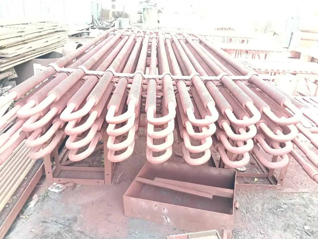 Superheater coil elements laid out on the shop floor